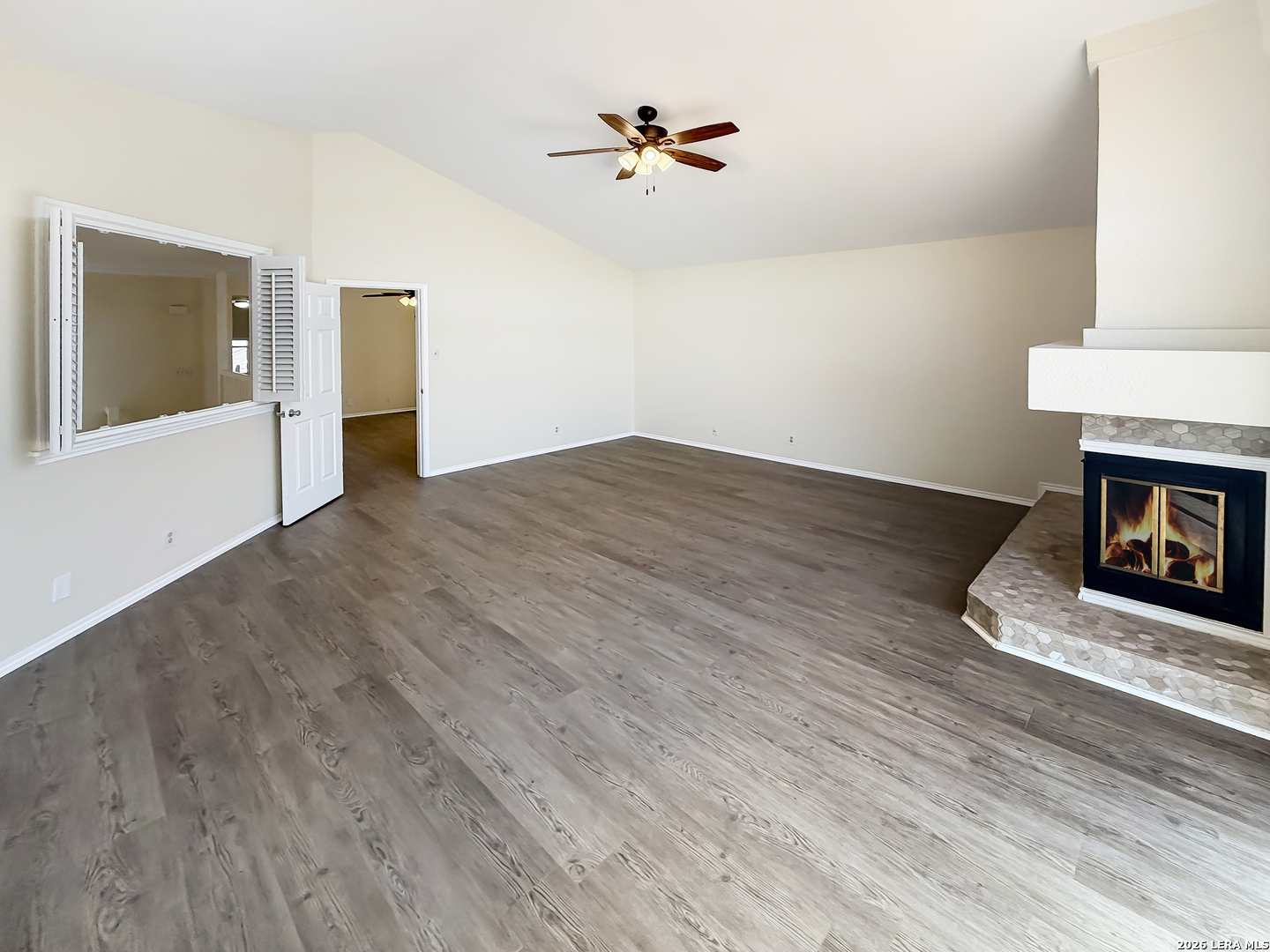 9808 Delta Ridge Drive Converse, TX 78109 - Photo 29 of 38 a view of an empty room with a fireplace and a window
