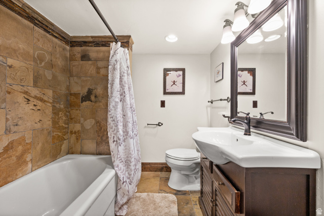 10280 Dimple Dell Road Sandy, UT 84092 - Photo 53 of 58 Full bath with vanity, shower / tub combo, stone tile floors, and recessed lighting
