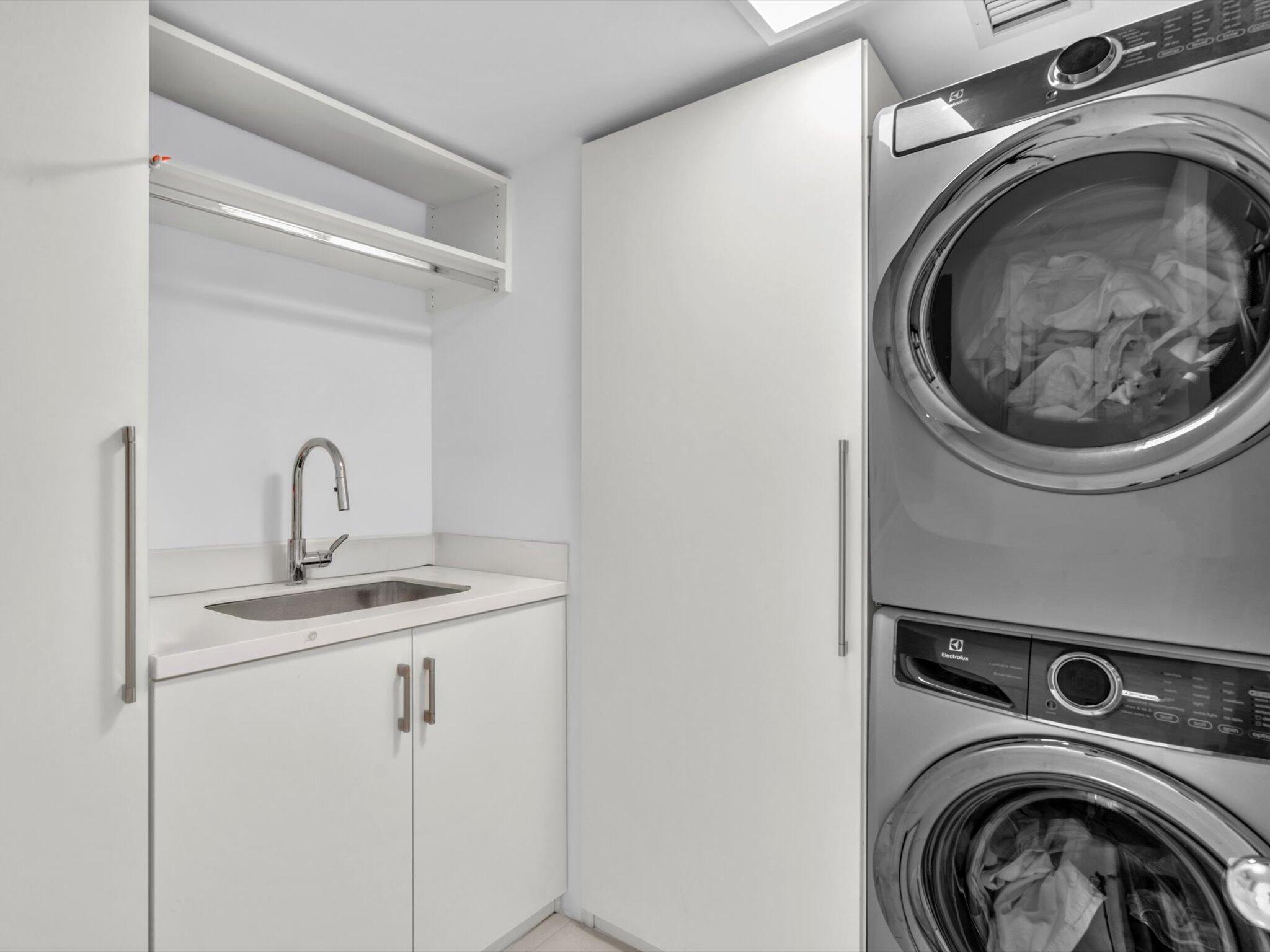 3300 South Ocean Boulevard, Unit 108S Palm Beach, FL 33480 - Photo 12 of 66 a utility room with sink dryer and washer