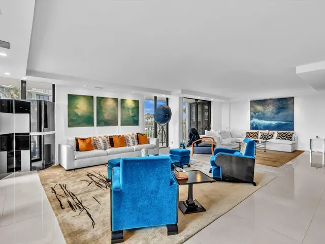 a bed room with furniture and a flat screen tv