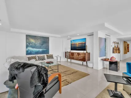 a bathroom with a granite countertop toilet sink and mirror