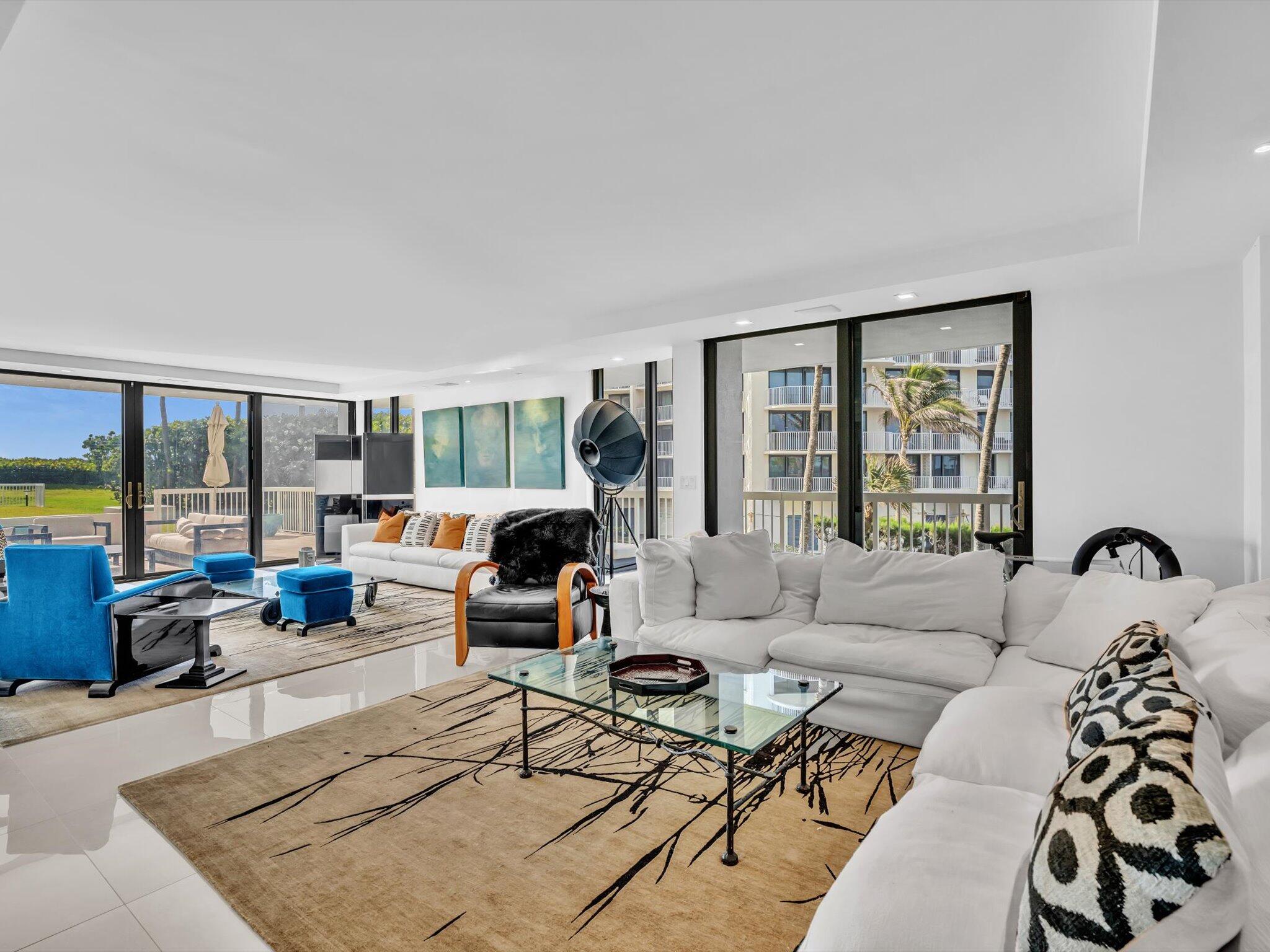 3300 South Ocean Boulevard, Unit 108S Palm Beach, FL 33480 - Photo 21 of 66 a living room with furniture large window and a table