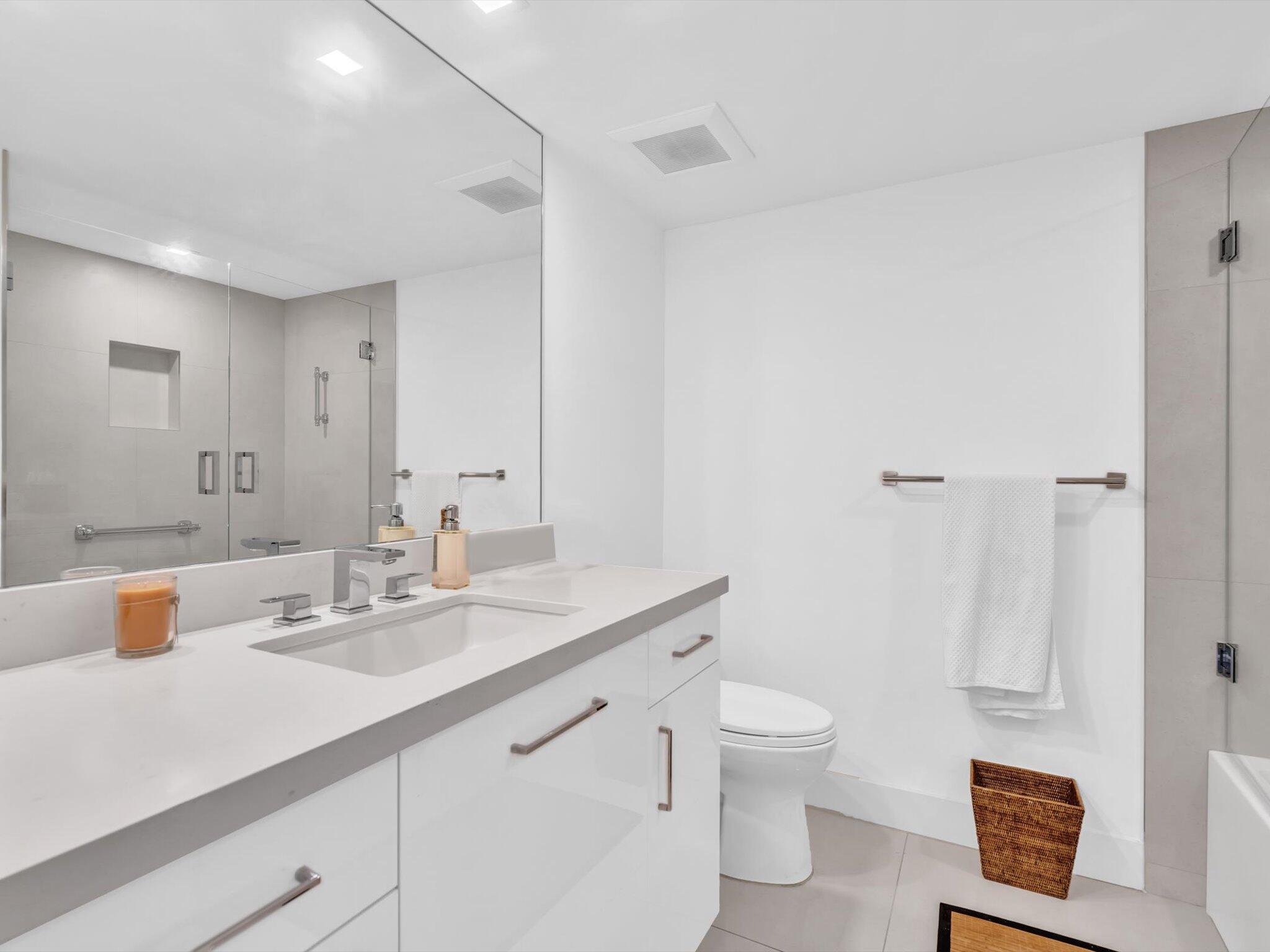 3300 South Ocean Boulevard, Unit 108S Palm Beach, FL 33480 - Photo 25 of 66 a bathroom with a sink a toilet and shower