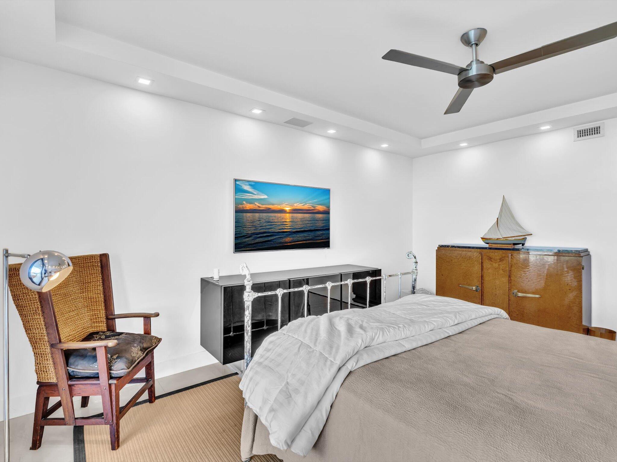 3300 South Ocean Boulevard, Unit 108S Palm Beach, FL 33480 - Photo 28 of 66 a bedroom with a bed and furniture