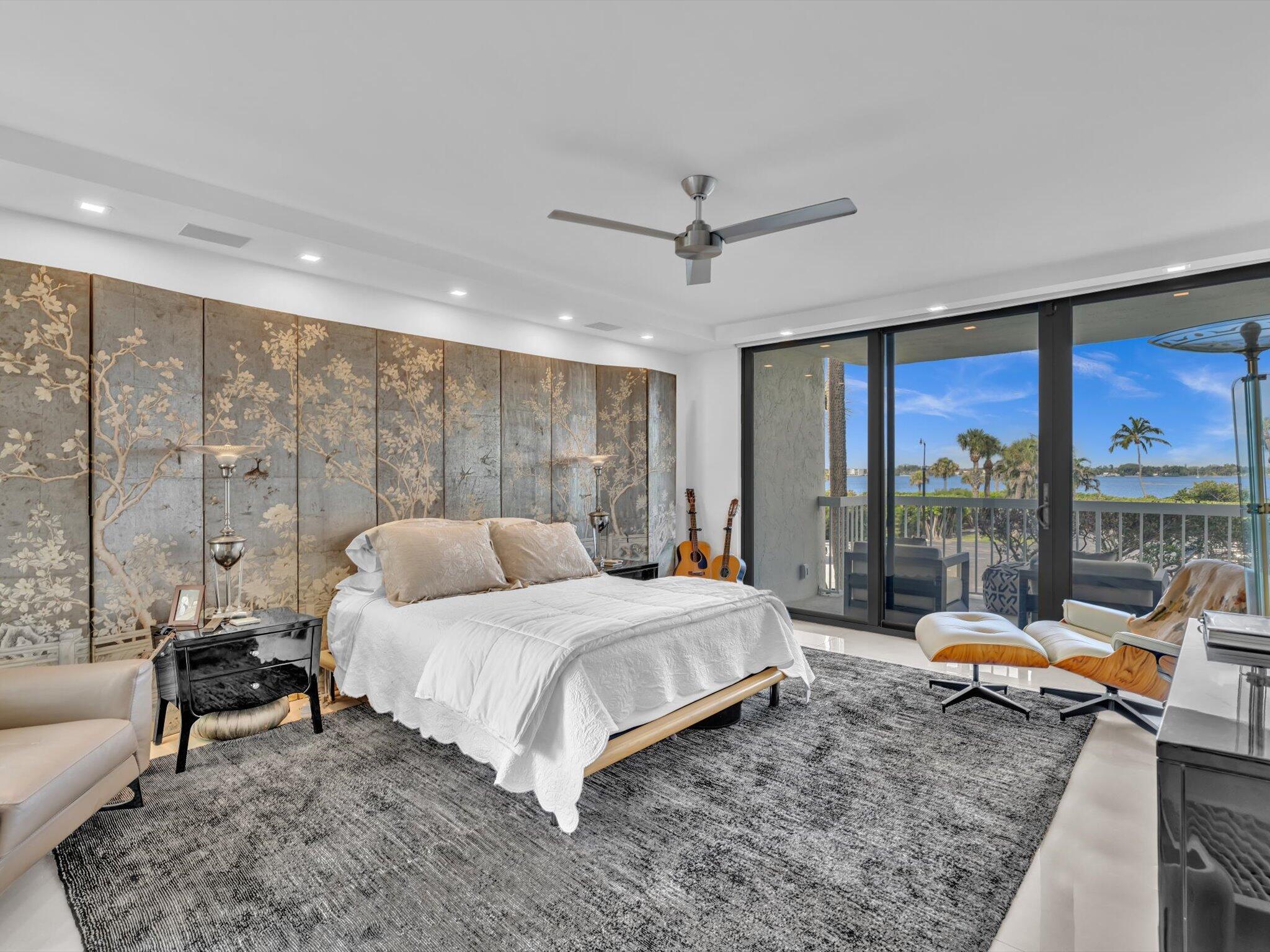 3300 South Ocean Boulevard, Unit 108S Palm Beach, FL 33480 - Photo 29 of 66 a bedroom with a bed and large windows