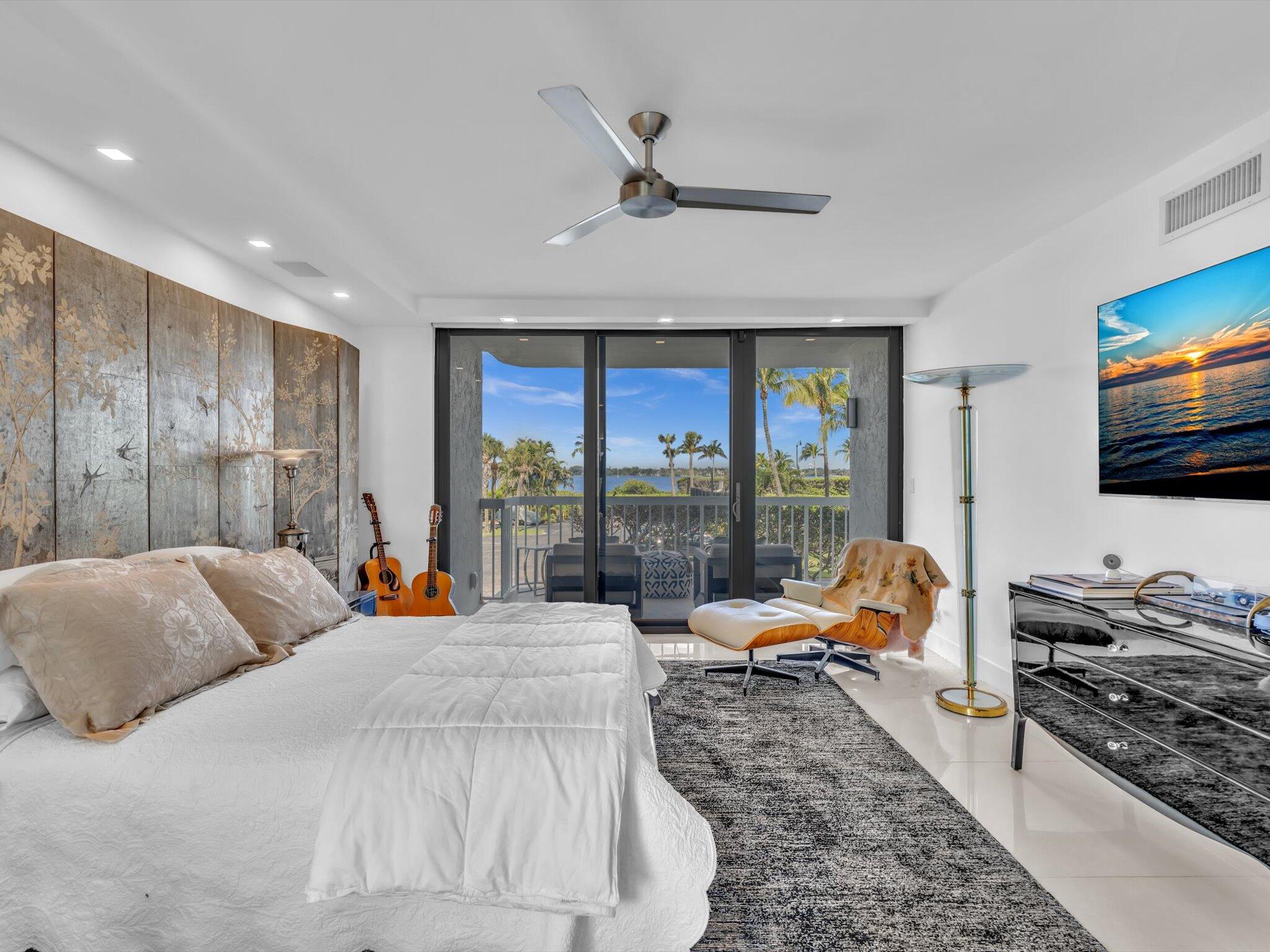 3300 South Ocean Boulevard, Unit 108S Palm Beach, FL 33480 - Photo 30 of 66 a large bedroom with a bed and large windows