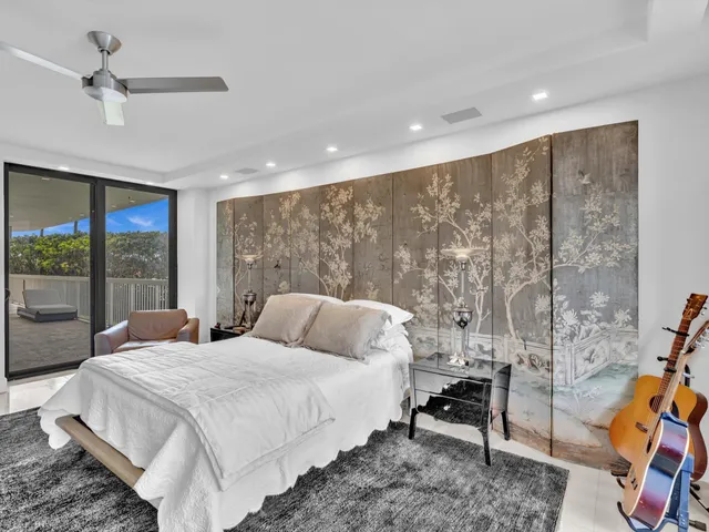 a view of a patio with couches table and chairs and potted plants