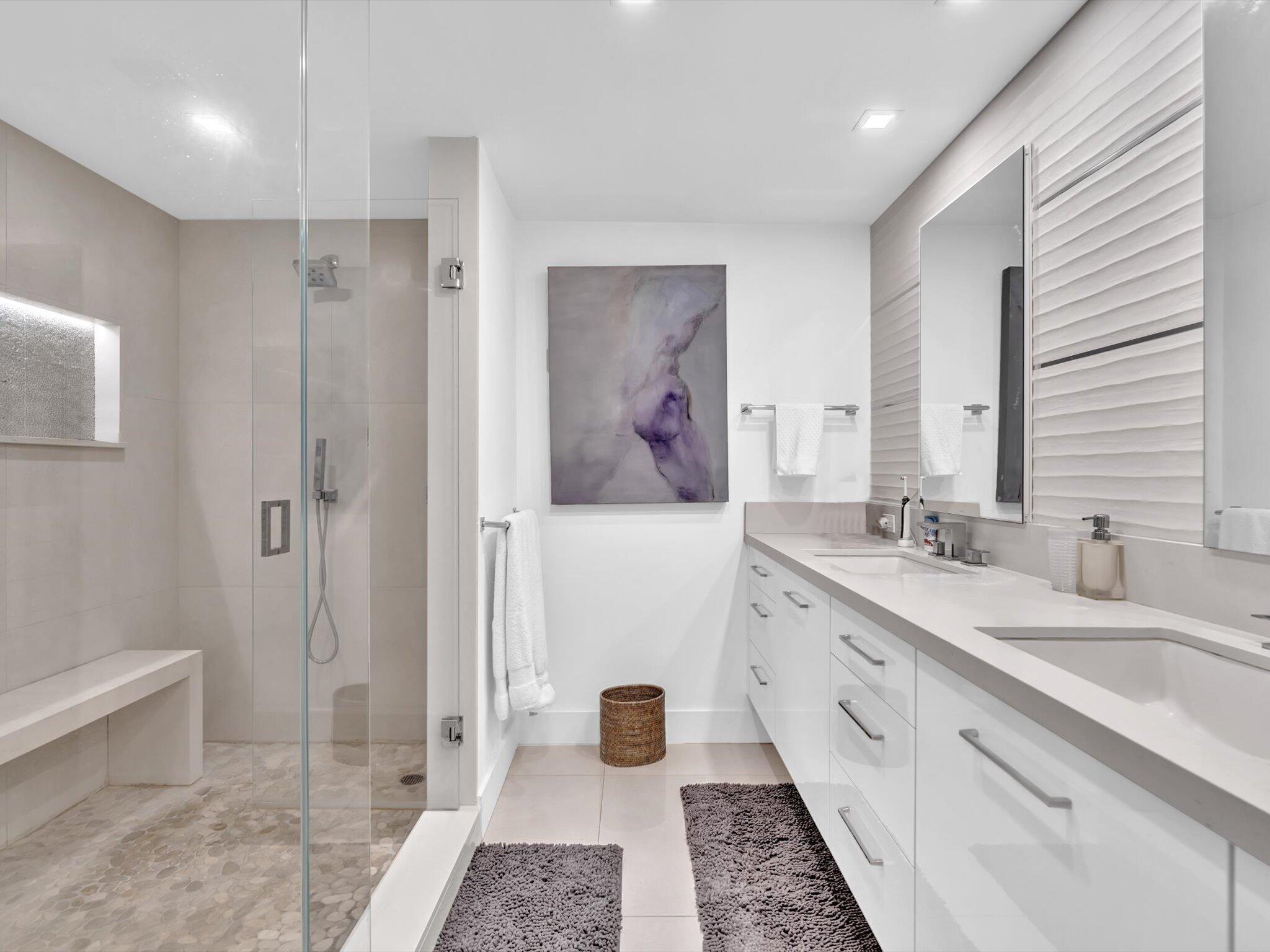 3300 South Ocean Boulevard, Unit 108S Palm Beach, FL 33480 - Photo 32 of 66 a bathroom with a double vanity sink a toilet and shower