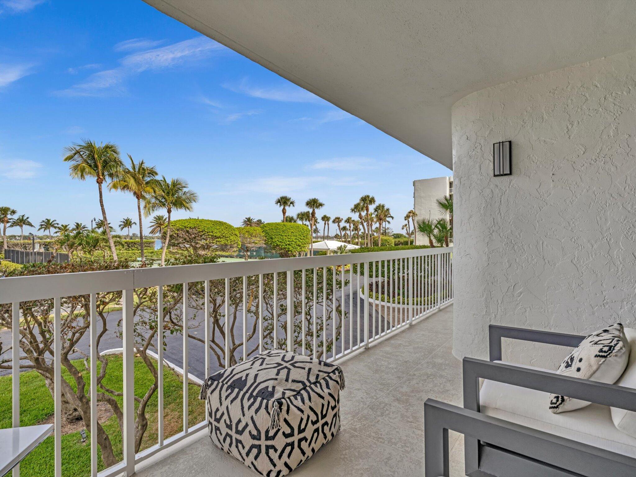 3300 South Ocean Boulevard, Unit 108S Palm Beach, FL 33480 - Photo 44 of 66 a balcony with furniture and potted plants