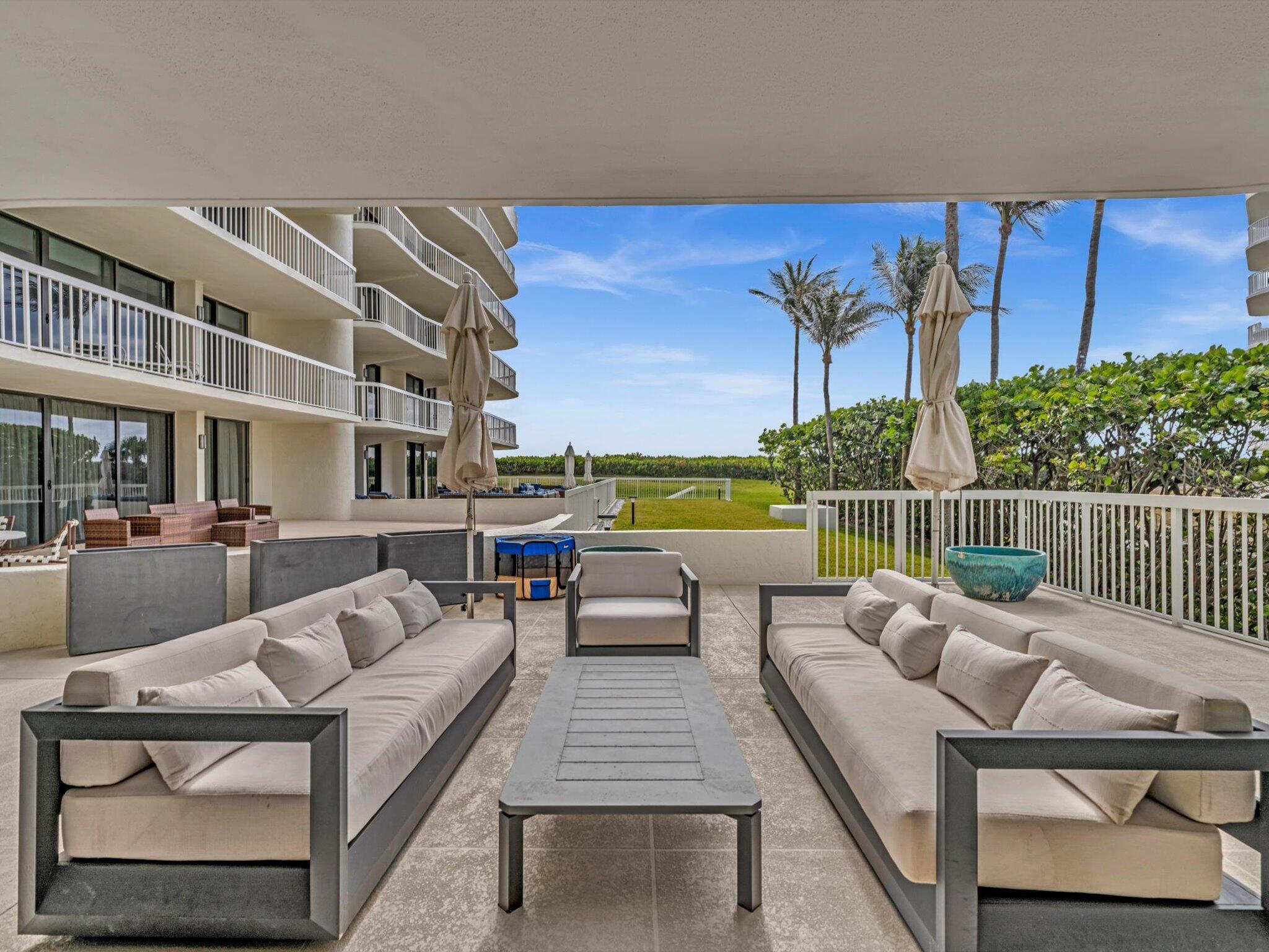 3300 South Ocean Boulevard, Unit 108S Palm Beach, FL 33480 - Photo 46 of 66 a building outdoor space with patio couches and potted plants