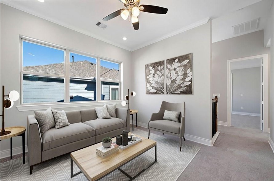 8907 Spring Knoll Forest Drive Houston, TX 77080 - Photo 15 of 21 a living room with furniture and a large window