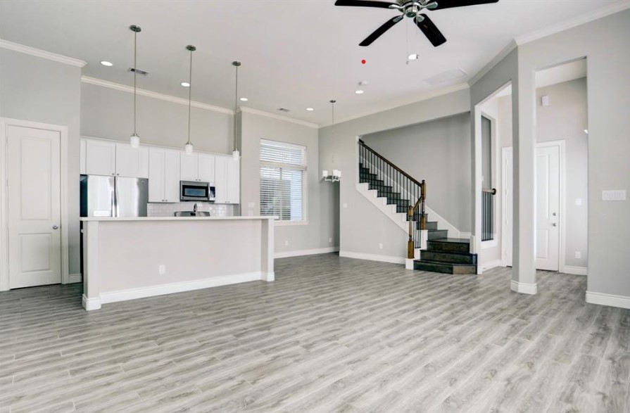 8907 Spring Knoll Forest Drive Houston, TX 77080 - Photo 6 of 21 a view of kitchen with stainless steel appliances kitchen island hardwood floor and a sink