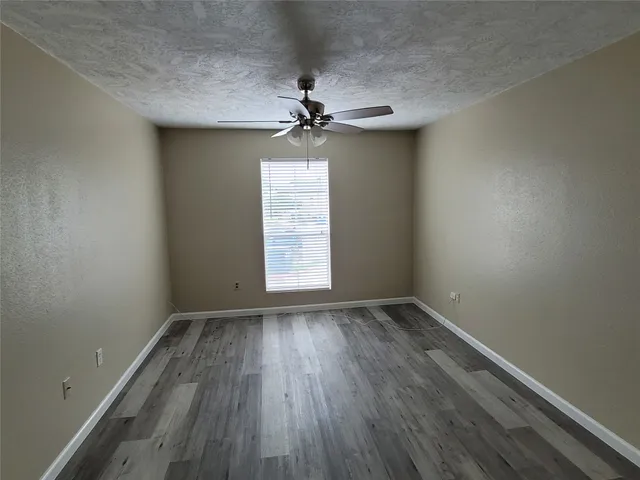 a bathroom with a sink a toilet a mirror and bathtub
