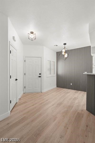 3320 South Fort Apache Road, Unit 125 Las Vegas, NV 89117 - Photo 6 of 26 Clean lines and a modern ceiling light define this inviting entry space.