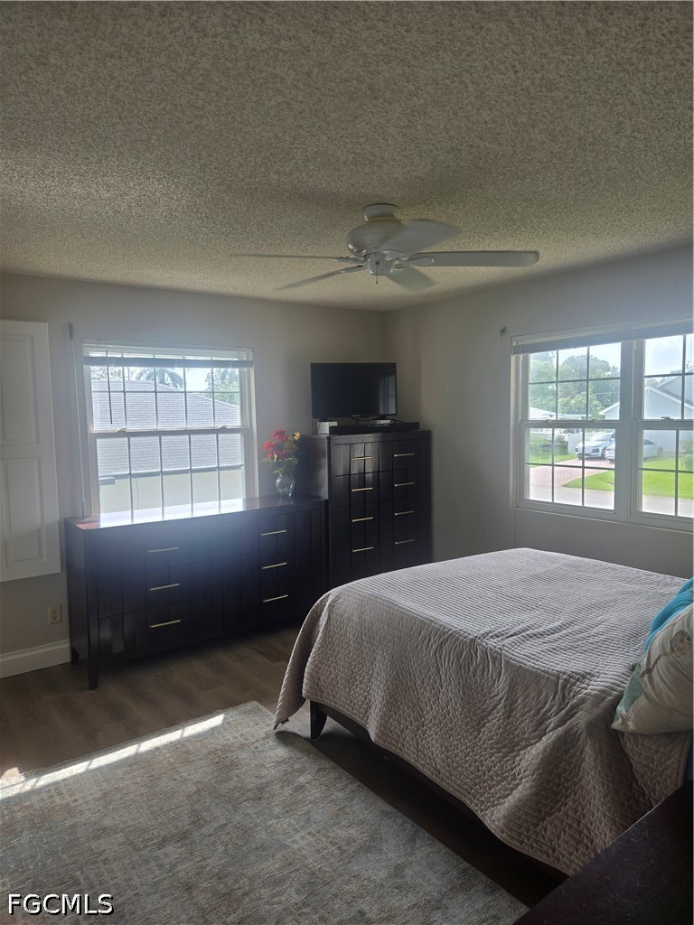 8093 Anhinga Road Fort Myers, FL 33967 - Photo 17 of 49 a bedroom with a bed and a window