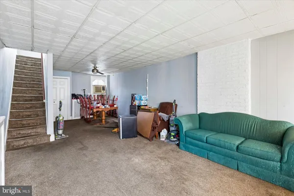 a living room with furniture and a couch