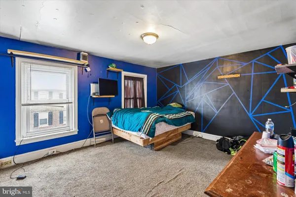 a living room with a couch and a window