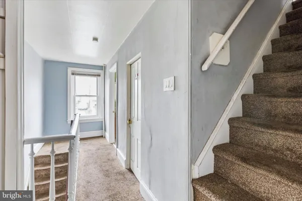 a bedroom with a bed and chair