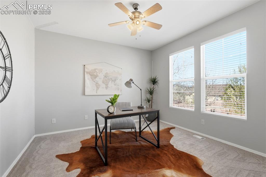 10744 Rhinestone Drive Colorado Springs, CO 80908 - Photo 12 of 50 a workspace with furniture and a window