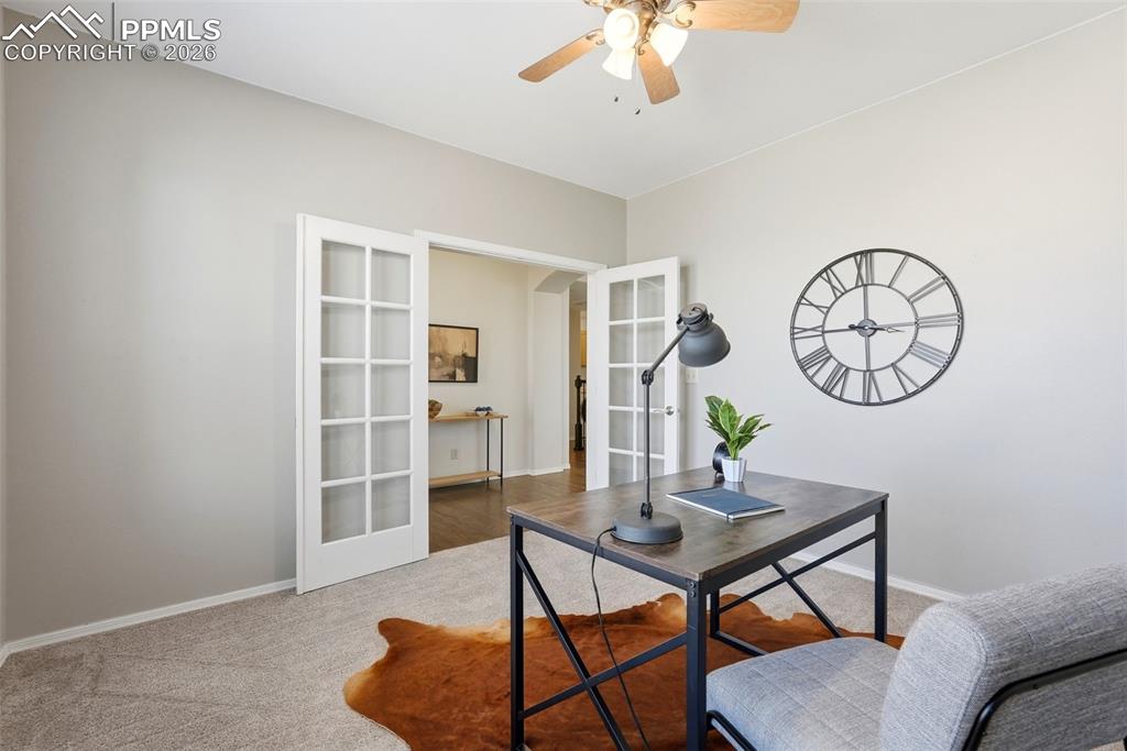 10744 Rhinestone Drive Colorado Springs, CO 80908 - Photo 13 of 50 a view of a livingroom with furniture a table and chairs