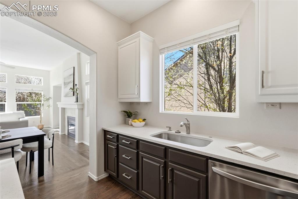 10744 Rhinestone Drive Colorado Springs, CO 80908 - Photo 14 of 50 a spacious bathroom with a granite countertop sink a mirror and a shower