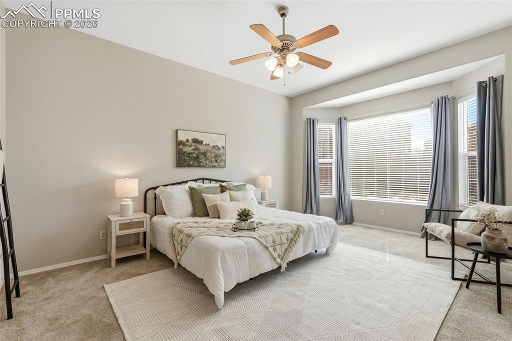 10744 Rhinestone Drive Colorado Springs, CO 80908 - Photo 20 of 50 a bedroom with a bed and a large window
