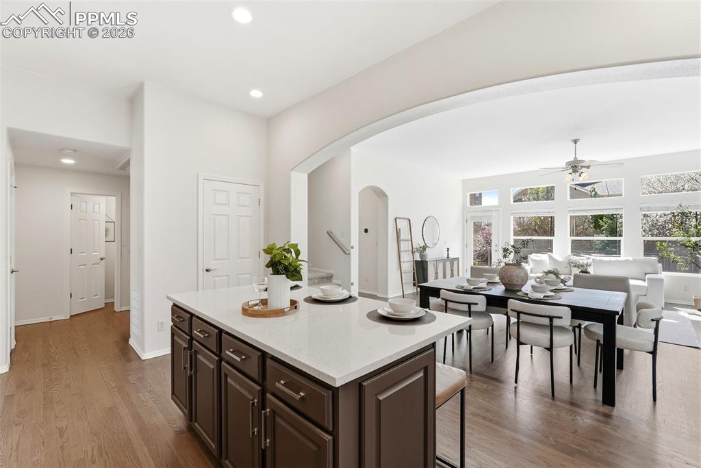 10744 Rhinestone Drive Colorado Springs, CO 80908 - Photo 3 of 50 a kitchen with a table chairs and wooden floor