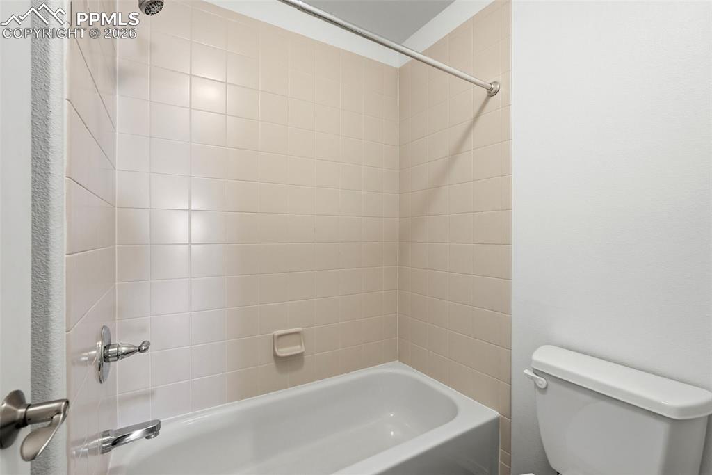 10744 Rhinestone Drive Colorado Springs, CO 80908 - Photo 32 of 50 a bathroom with a white bath tub and a shower