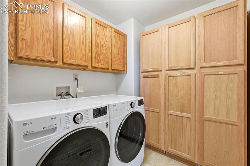 10744 Rhinestone Drive Colorado Springs, CO 80908 - Photo 37 of 50 a view of storage and utility room with washer and dryer