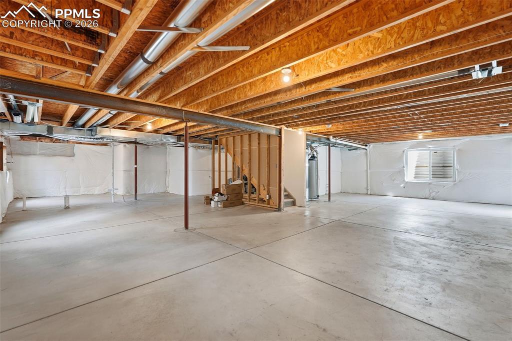 10744 Rhinestone Drive Colorado Springs, CO 80908 - Photo 40 of 50 a view of a room with wooden ceiling