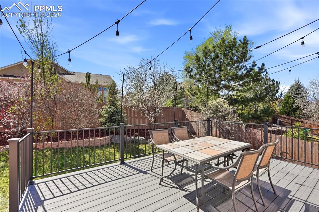 10744 Rhinestone Drive Colorado Springs, CO 80908 - Photo 41 of 50 a view of a chairs and table on the deck