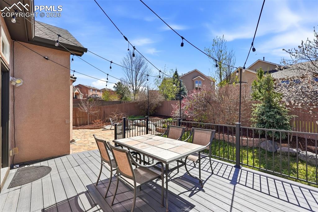 10744 Rhinestone Drive Colorado Springs, CO 80908 - Photo 42 of 50 a view of a patio with a table and chairs
