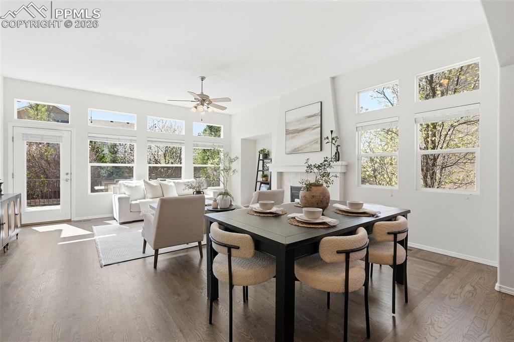 10744 Rhinestone Drive Colorado Springs, CO 80908 - Photo 5 of 50 a view of a dining room with furniture wooden floor and a chandelier