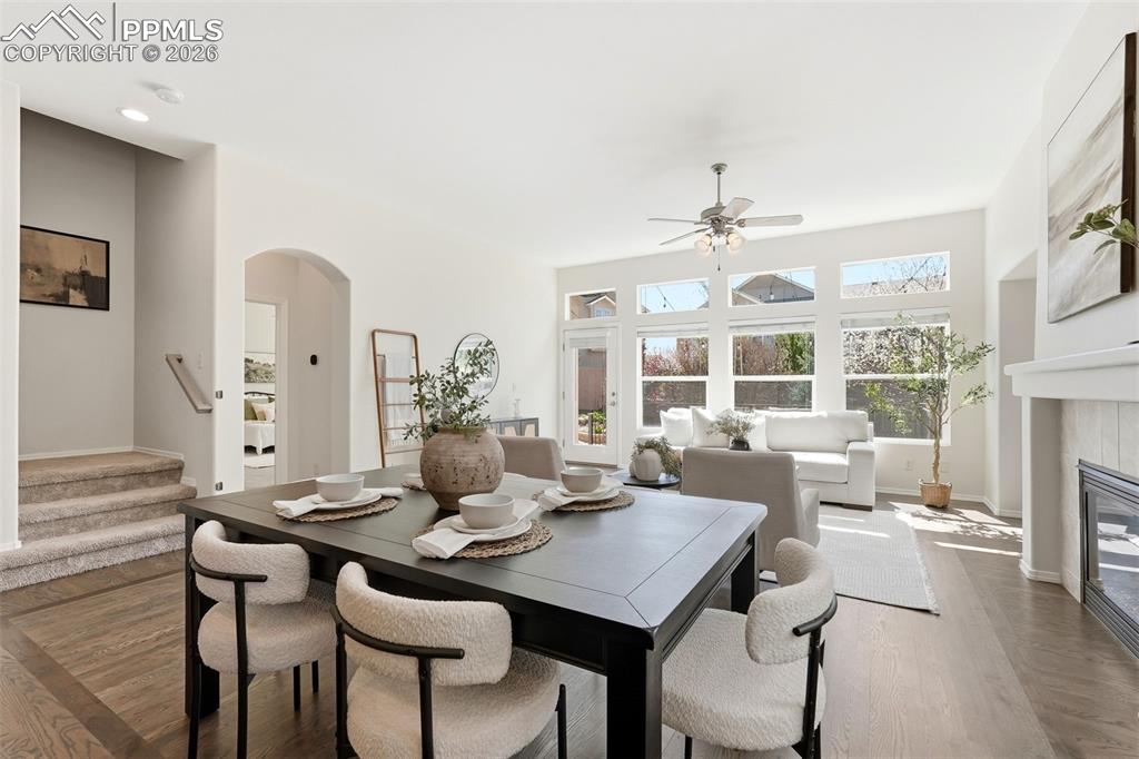 10744 Rhinestone Drive Colorado Springs, CO 80908 - Photo 6 of 50 a view of a dining room with furniture window and wooden floor