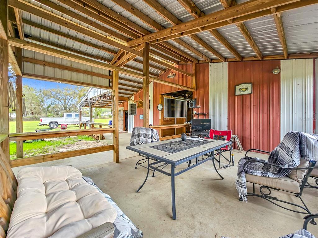 41204 Emeralda Island Road Leesburg, FL 34788 - Photo 12 of 53 a building outdoor space with patio furniture