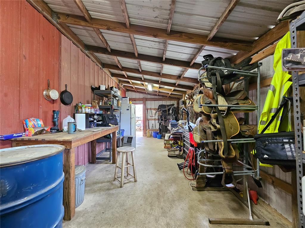 41204 Emeralda Island Road Leesburg, FL 34788 - Photo 30 of 53 a view of a storage room with racks