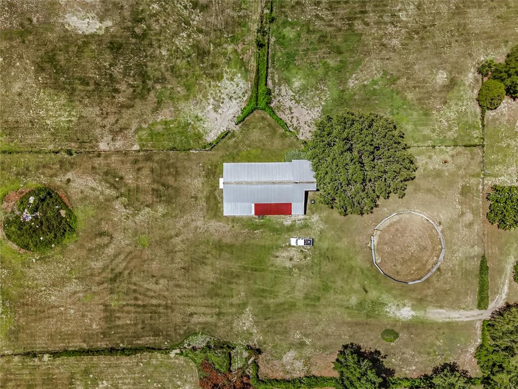 41204 Emeralda Island Road Leesburg, FL 34788 - Photo 35 of 53 a picture of a bathroom with a sink and mirror