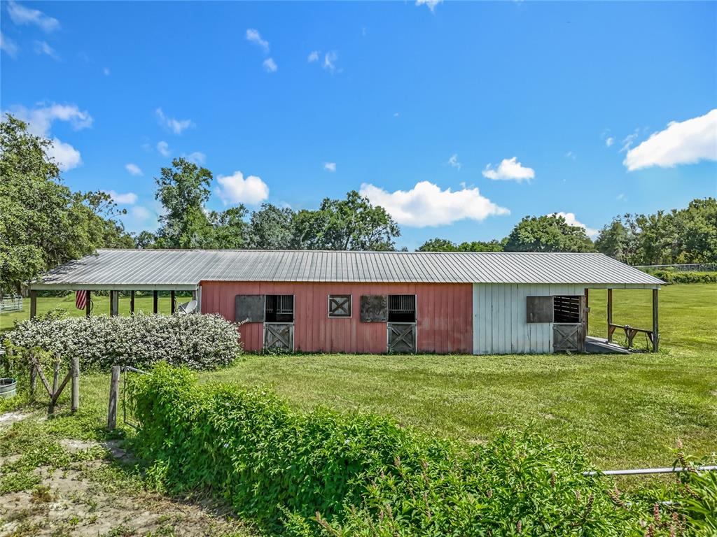 41204 Emeralda Island Road Leesburg, FL 34788 - Photo 42 of 53 a front view of house with yard and green space