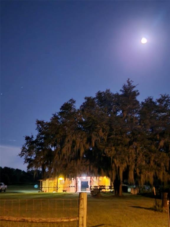 41204 Emeralda Island Road Leesburg, FL 34788 - Photo 53 of 53 a view of a swimming pool with an outdoor space and seating area