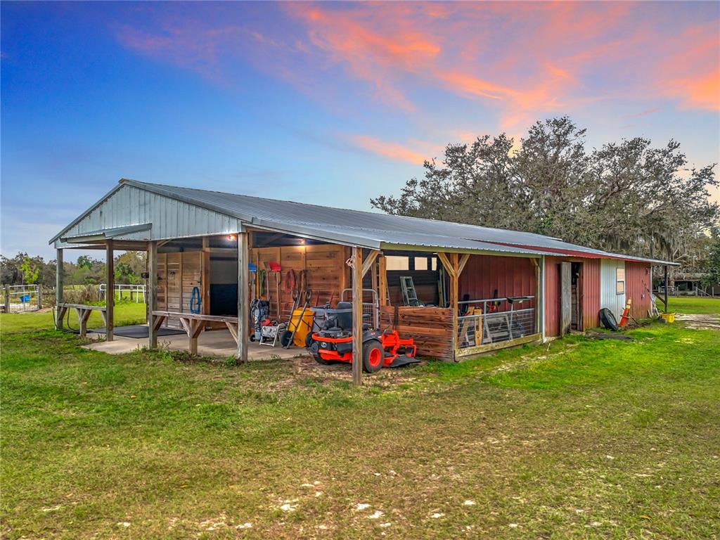 41204 Emeralda Island Road Leesburg, FL 34788 - Photo 6 of 53 a view of a house with backyard and porch