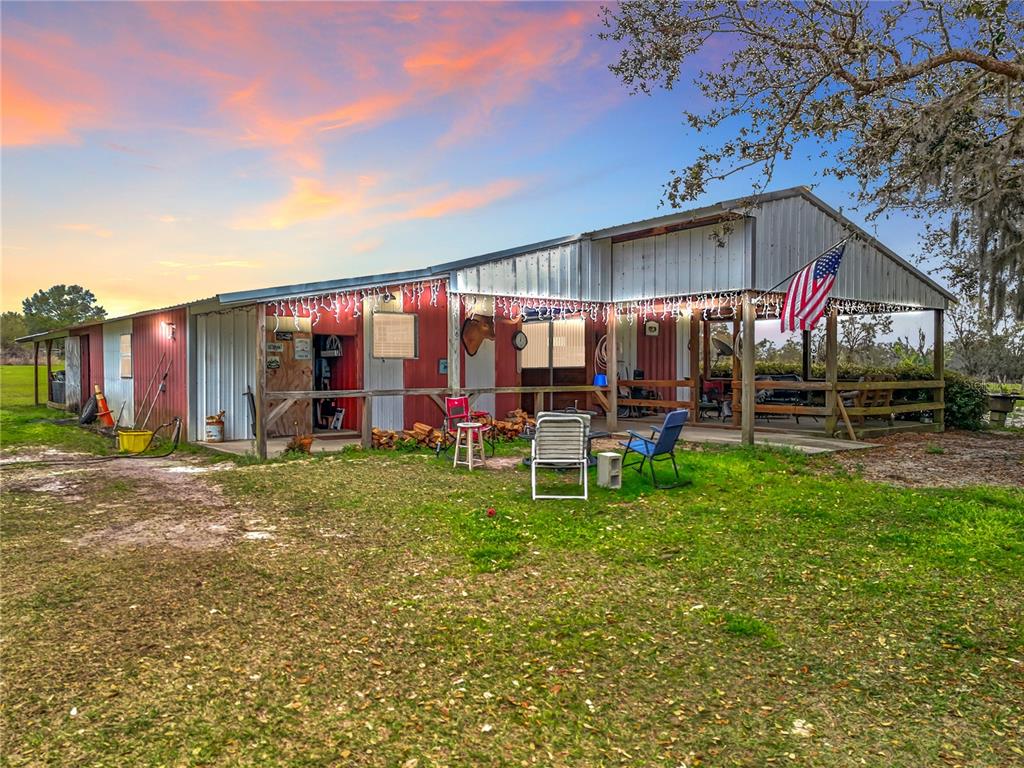 41204 Emeralda Island Road Leesburg, FL 34788 - Photo 7 of 53 a view of a house with a yard porch and sitting area