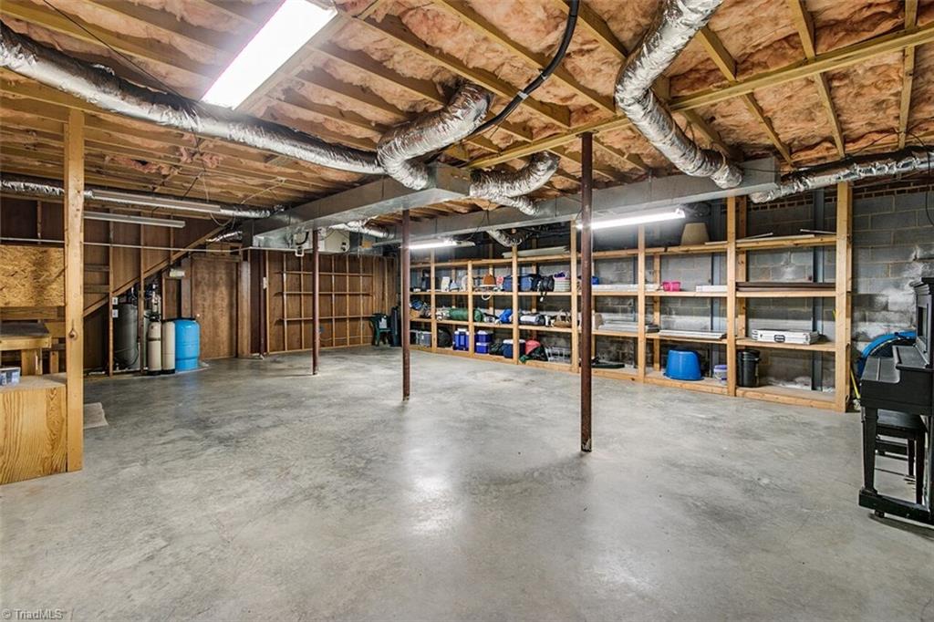 5902 Dehaven Road Pleasant Garden, NC 27313 - Photo 23 of 27 Unfinished basement area offers plenty of space for storage