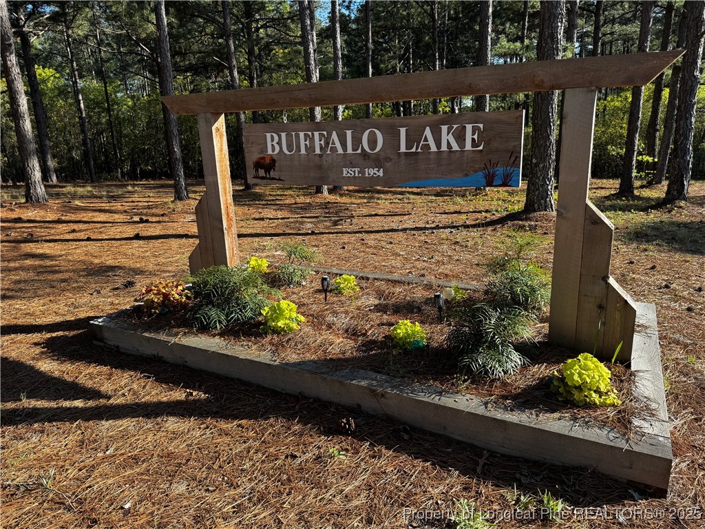 864 Vic Keith Road Sanford, NC 27332 - Photo 3 of 19 a view of a street with a building in the background