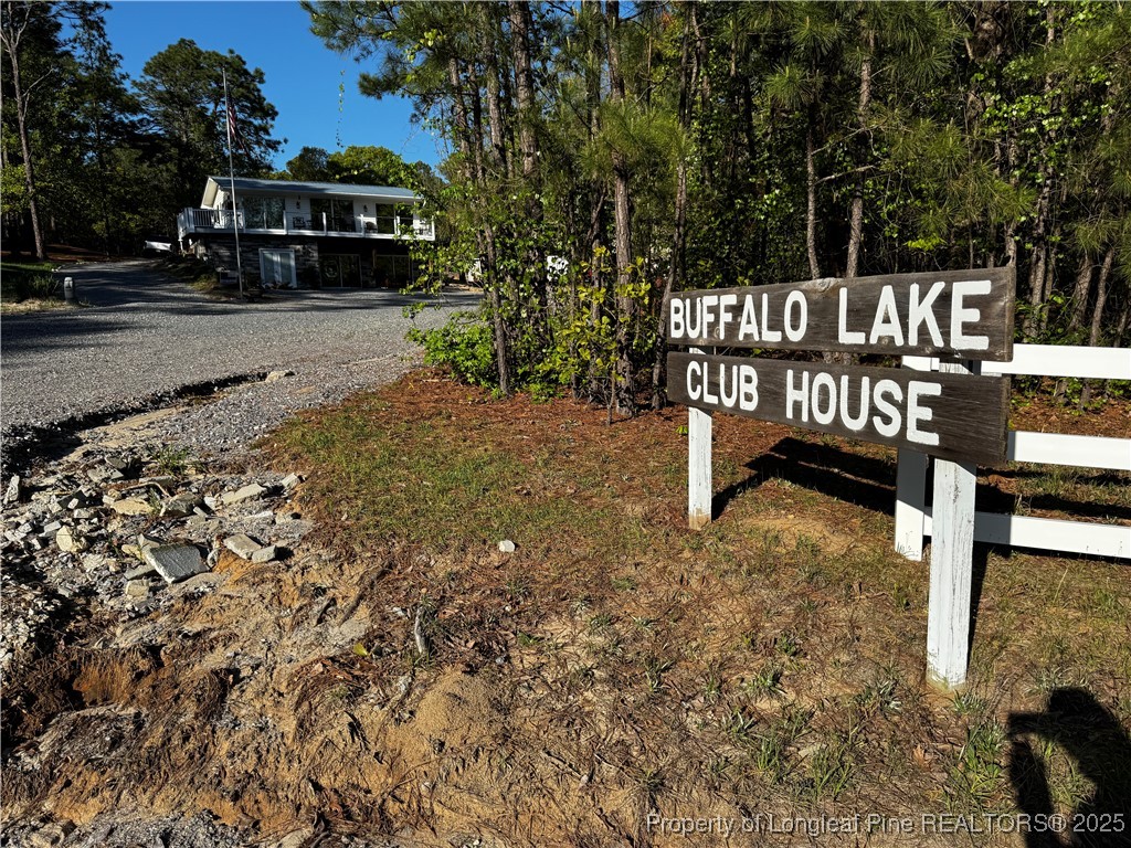 864 Vic Keith Road Sanford, NC 27332 - Photo 4 of 19 a view of street with bench and trees