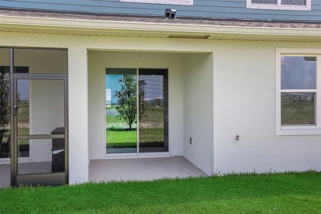 a front view of a house with garden and porch