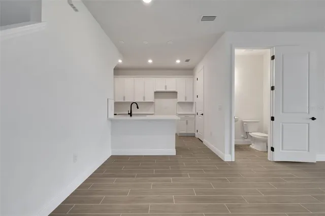 a view of kitchen with wooden floor
