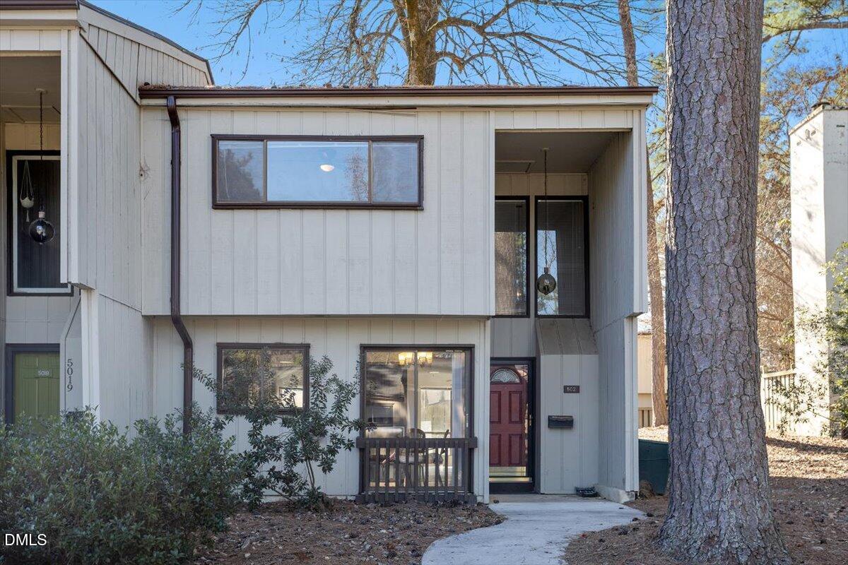 a front view of a house with glass windows and door