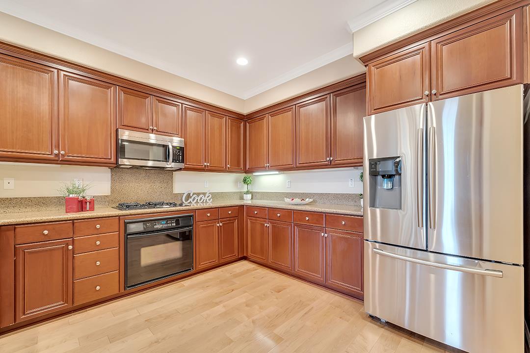 412 Joree Lane San Ramon, CA 94582 - Photo 8 of 44 a kitchen with stainless steel appliances granite countertop a refrigerator stove top oven and cabinets