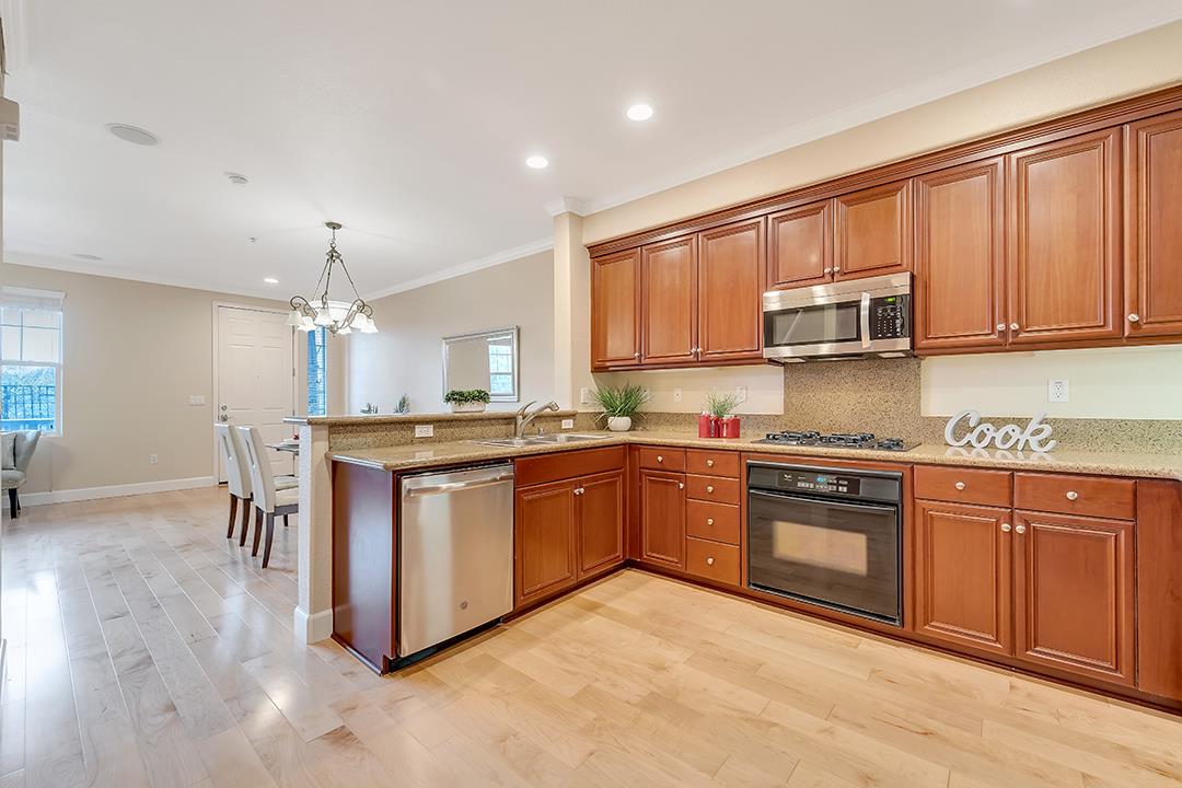 412 Joree Lane San Ramon, CA 94582 - Photo 9 of 44 a kitchen with stainless steel appliances granite countertop a stove a sink dishwasher and a microwave oven with white cabinets