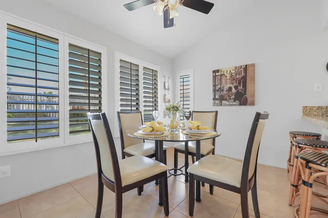 a view of a dining room with furniture and window